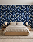 Hanging Garden Midnight botanical wallpaper behind a low platform bed in a serene Japandi bedroom