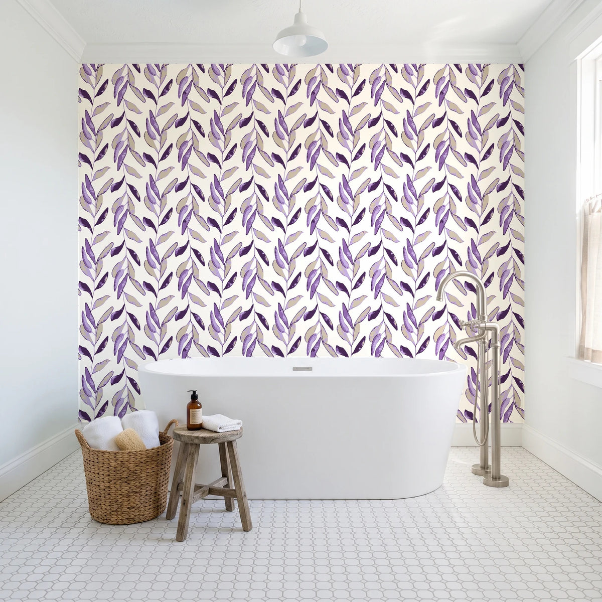 Hanging Garden Plum botanical wallpaper behind a freestanding tub in a bright coastal bathroom
