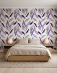 Hanging Garden Plum botanical wallpaper behind a low platform bed in a serene Japandi bedroom