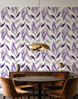 Hanging Garden Plum botanical wallpaper behind a walnut credenza and round table in an elegant dining room