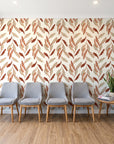 Hanging Garden Terracotta botanical wallpaper behind a row of upholstered chairs in a bright clinic waiting room