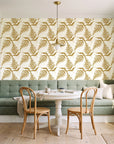 Harbor Fern Ochre fern wallpaper as a feature wall in a sunlit breakfast nook