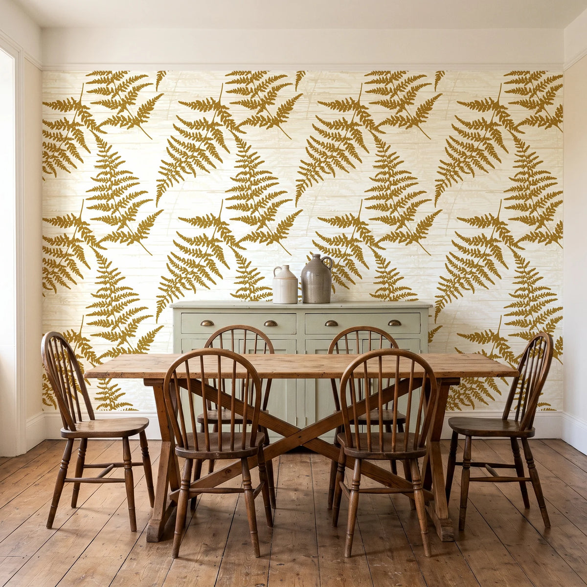 Harbor Fern Ochre fern wallpaper in a farmhouse dining room with a sage sideboard and rustic trestle table