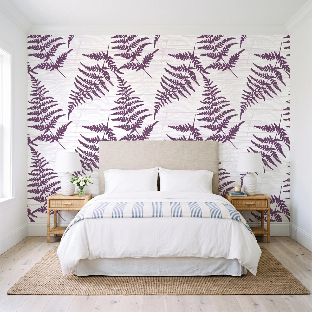Harbor Fern Plum fern wallpaper behind a queen bed in a bright coastal bedroom