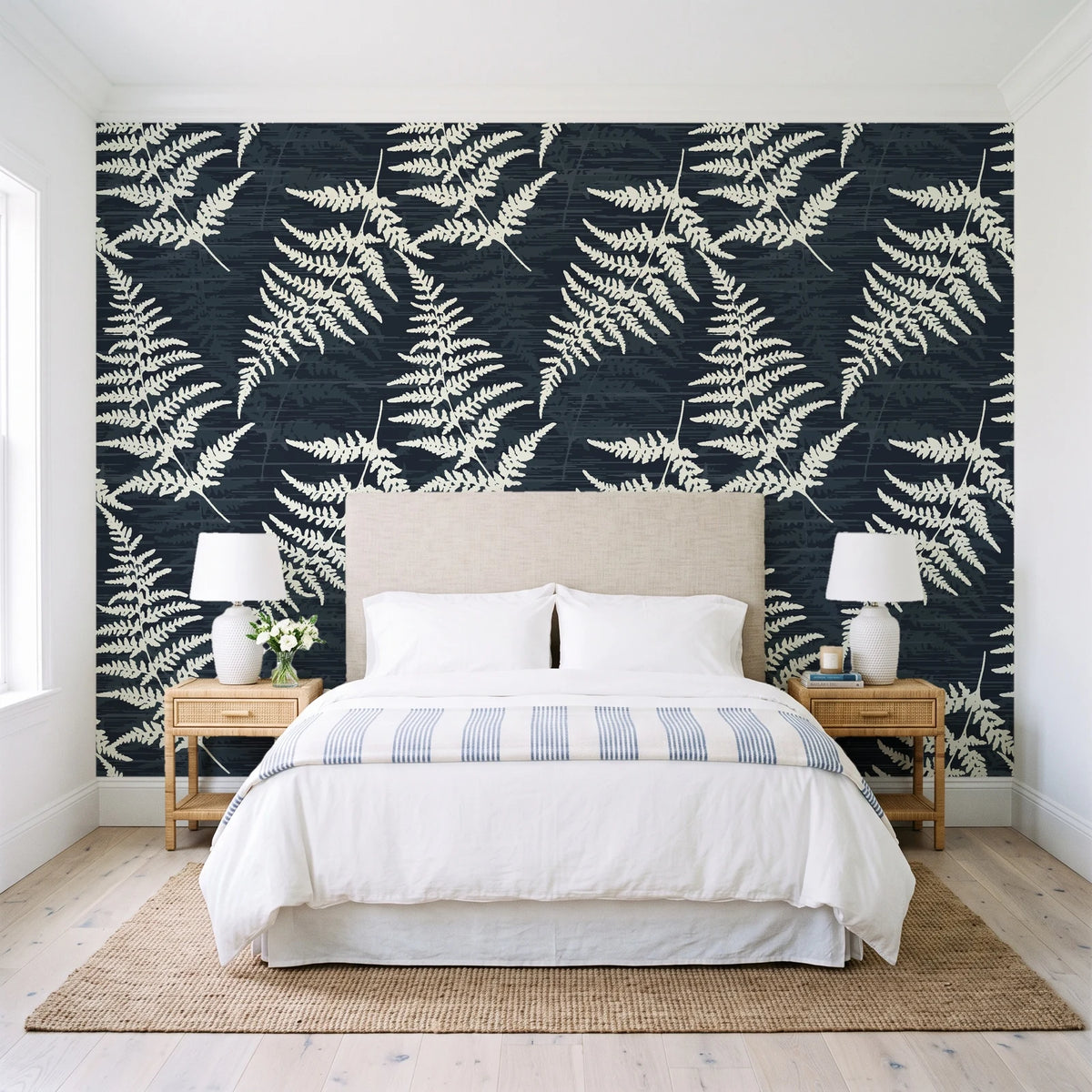 Harbor Fern Slate fern wallpaper behind a queen bed in a bright coastal bedroom