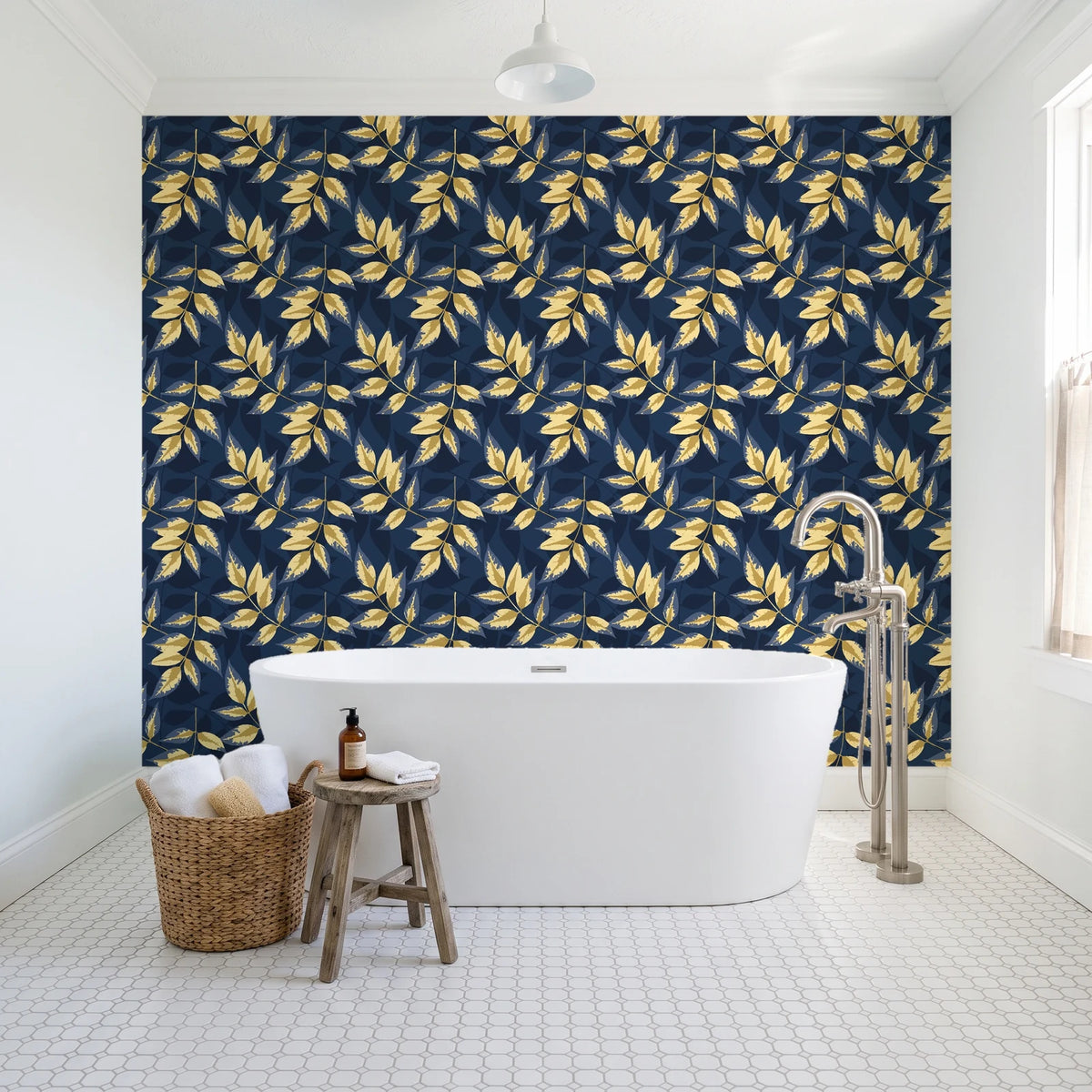 Harvest Crown Midnight leafy branch wallpaper behind a freestanding tub in a bright coastal bathroom