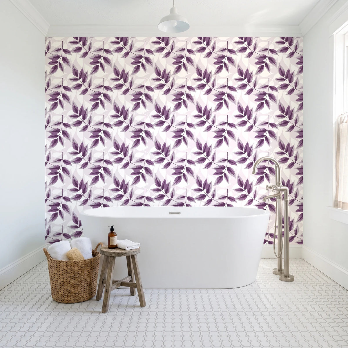 Harvest Crown Plum leafy branch wallpaper behind a freestanding tub in a bright coastal bathroom