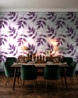 Harvest Crown Plum leafy branch wallpaper in a dark moody dining room with a candlelit table