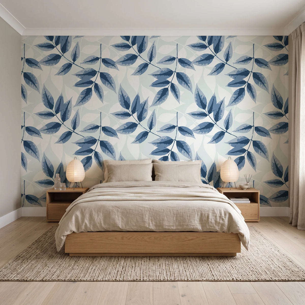Harvest Crown Slate leafy branch wallpaper behind a low platform bed in a serene Japandi bedroom