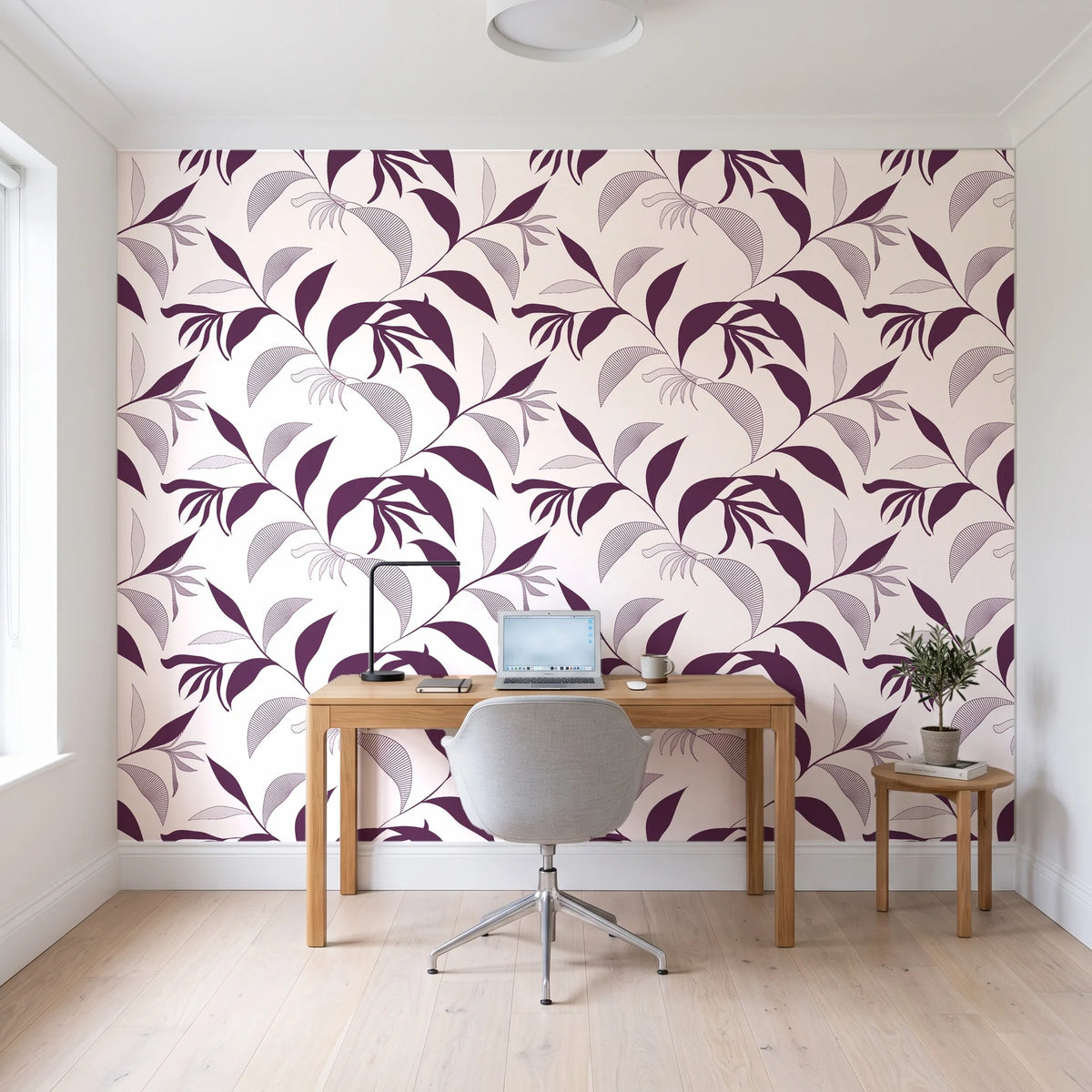 Hatched Frond Plum hatched frond wallpaper behind a modern oak desk in a bright home office