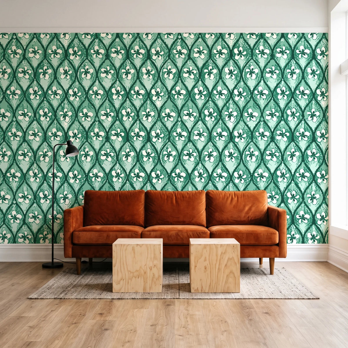Hidden Court Emerald floral ogee wallpaper behind a rust velvet sofa in a bright coworking lounge