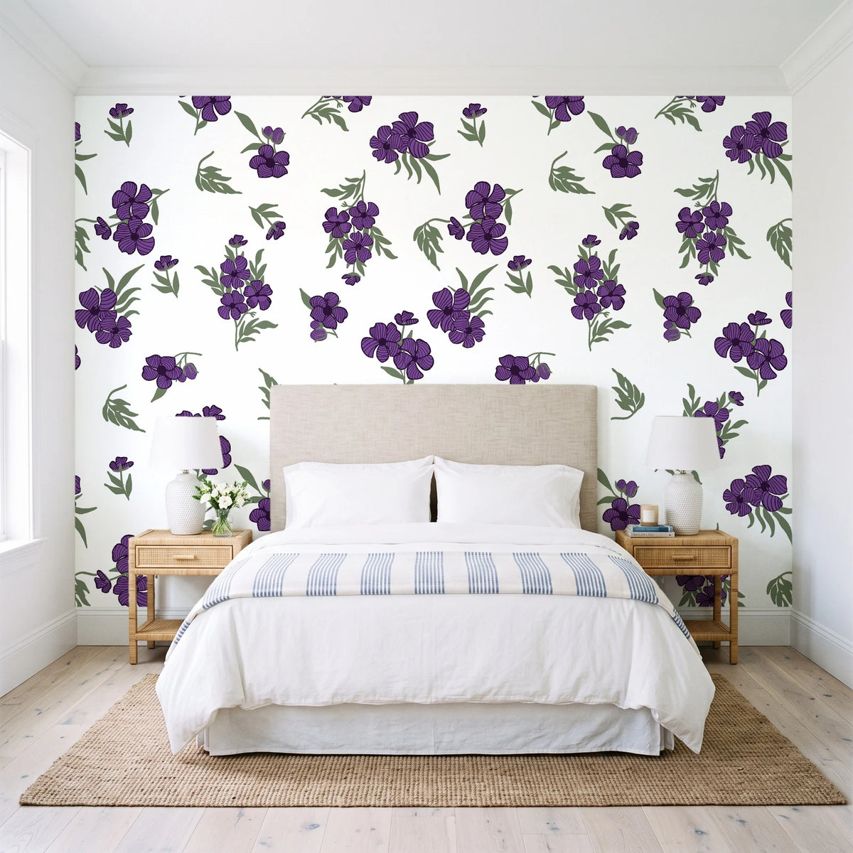 Hidden Garden Aubergine floral wallpaper behind a queen bed in a bright coastal bedroom