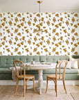 Hidden Garden Marigold floral wallpaper as a feature wall in a sunlit breakfast nook