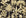 Hush & Palm Ebony palm trees wallpaper in black and gold
