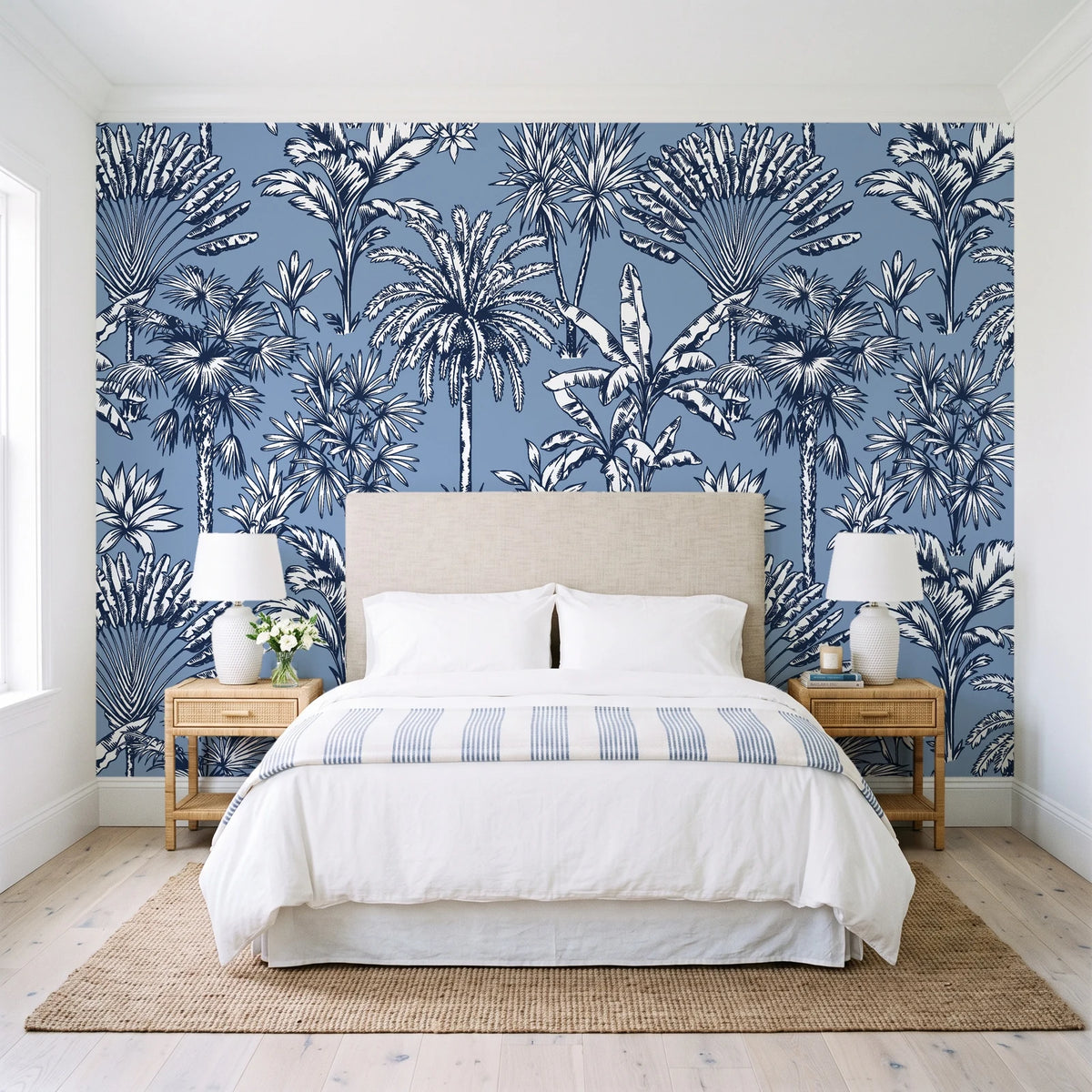 Hush & Palm Midnight palm trees wallpaper behind a queen bed in a bright coastal bedroom