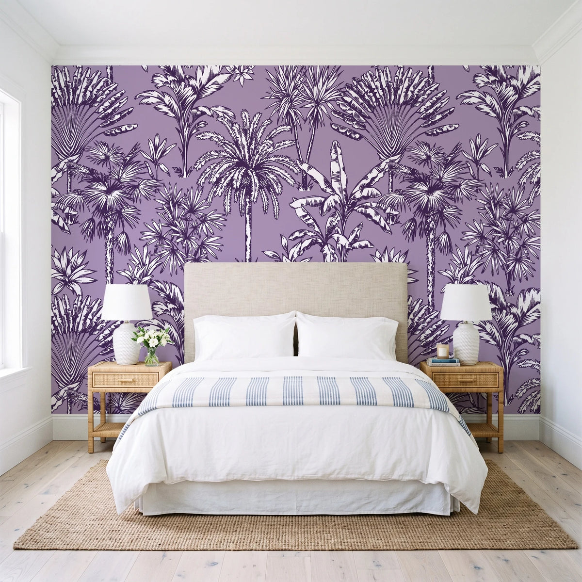 Hush & Palm Plum palm trees wallpaper behind a queen bed in a bright coastal bedroom