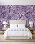 Hush & Palm Plum palm trees wallpaper behind a queen bed in a bright coastal bedroom