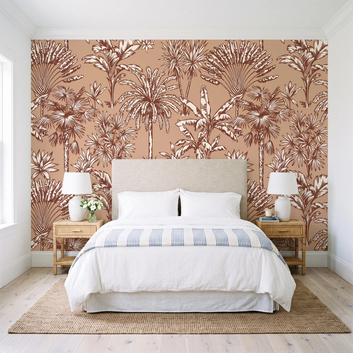 Hush & Palm Terracotta palm trees wallpaper behind a queen bed in a bright coastal bedroom