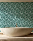 Indigo Labyrinth Emerald geometric wallpaper creating ambiance in a serene spa bathroom