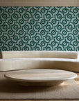 Indigo Labyrinth Emerald geometric wallpaper in an elegant living room