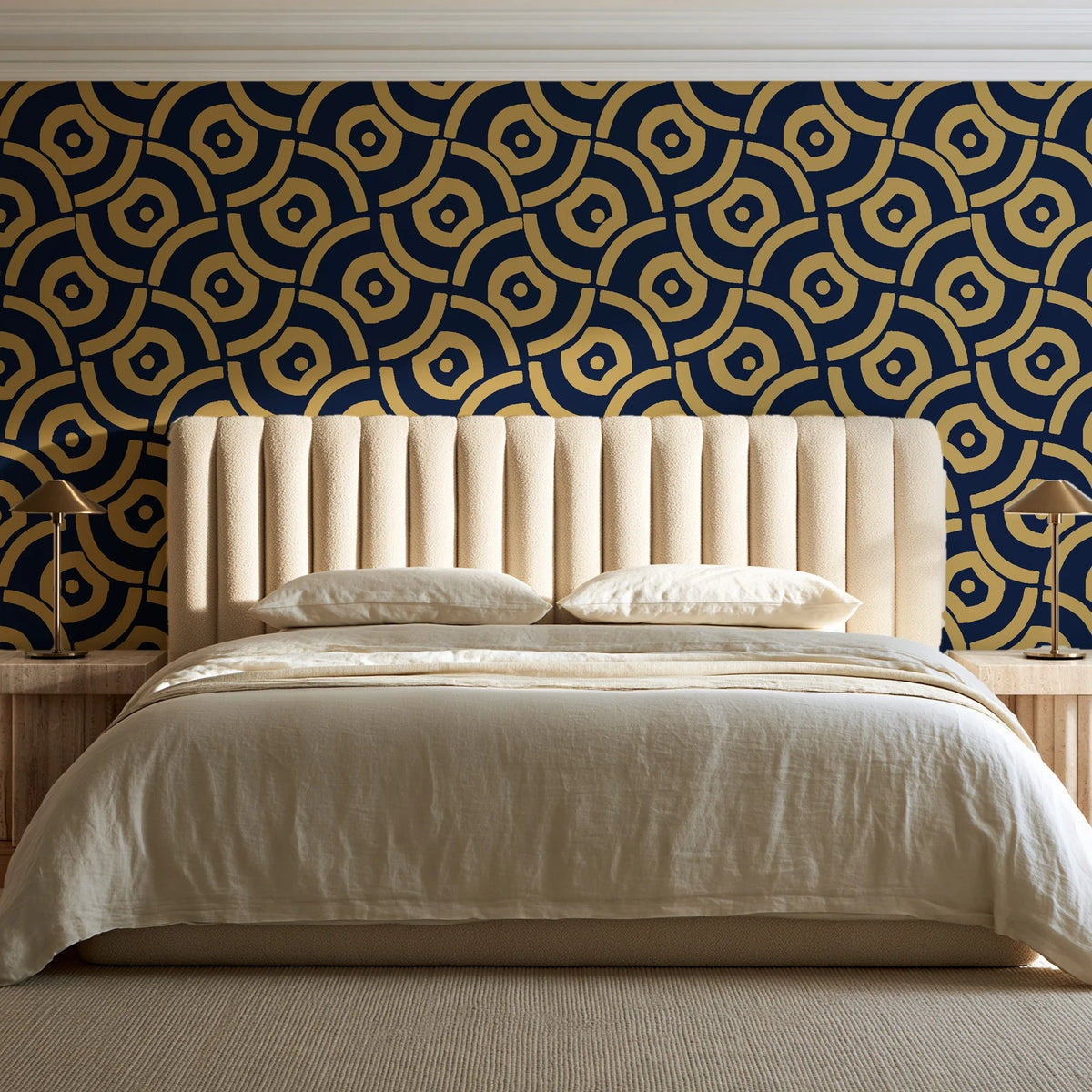 Indigo Labyrinth Midnight Gold geometric wallpaper behind a channel-tufted bed in a calm primary bedroom