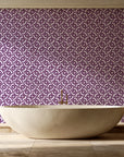 Indigo Labyrinth Plum geometric wallpaper creating ambiance in a serene spa bathroom