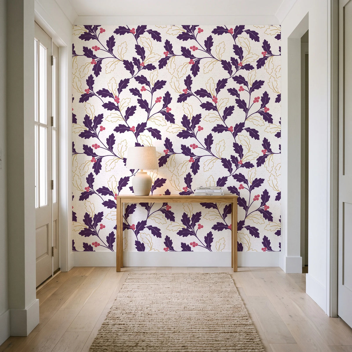 Ink & Oak Aubergine oak leaf and berry wallpaper behind a console table in a light entry hallway