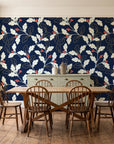 Ink & Oak Midnight oak leaf and berry wallpaper in a farmhouse dining room with a sage sideboard and rustic trestle table