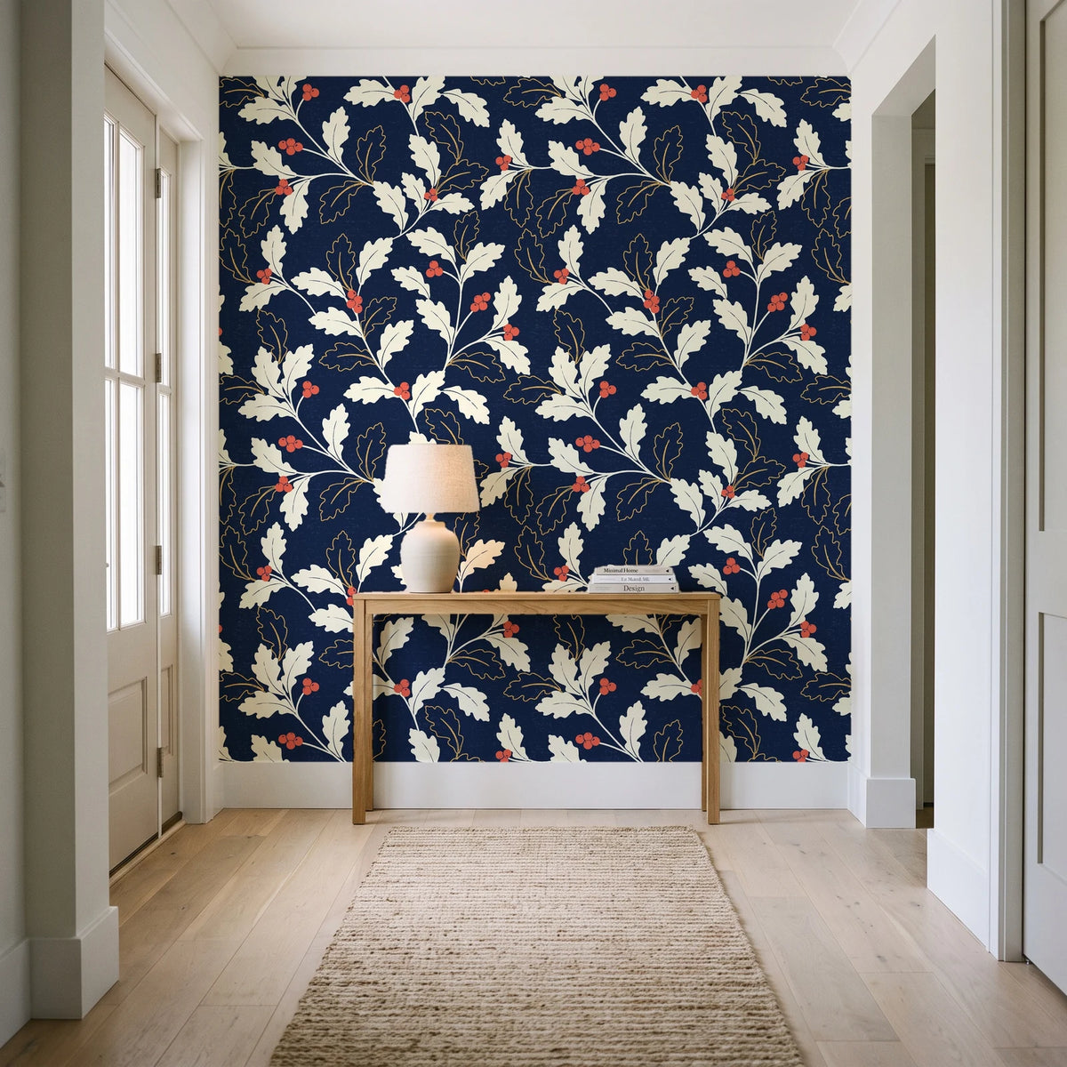 Ink & Oak Midnight oak leaf and berry wallpaper behind a console table in a light entry hallway