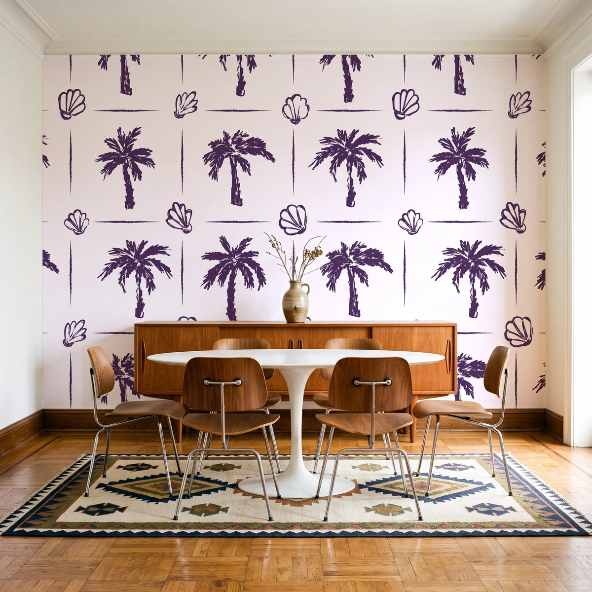 Ink & Shell Aubergine coastal palm and shell wallpaper in a mid-century dining room with a teak sideboard and tulip table