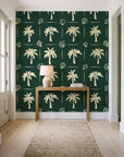 Ink & Shell Forest coastal palm and shell wallpaper behind a console table in a light entry hallway