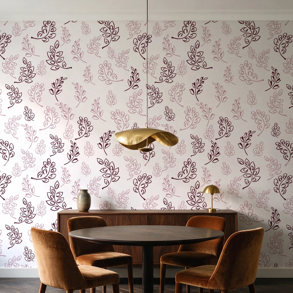 Ink & Sprig Burgundy botanical sprig wallpaper behind a walnut credenza and round table in an elegant dining room