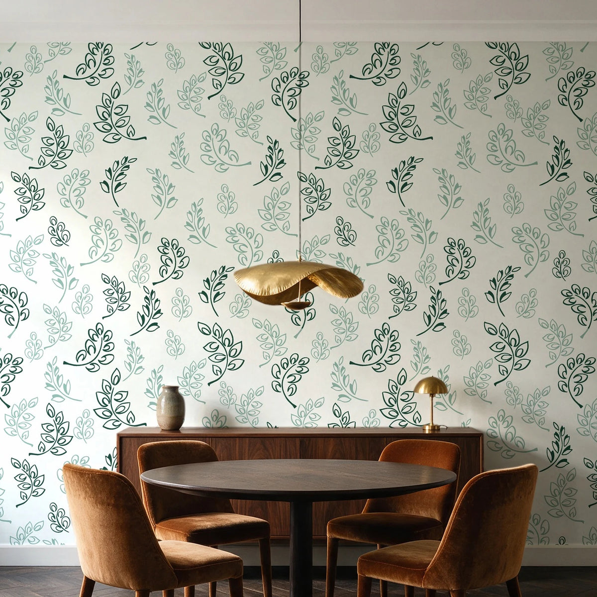 Ink & Sprig Emerald botanical sprig wallpaper behind a walnut credenza and round table in an elegant dining room