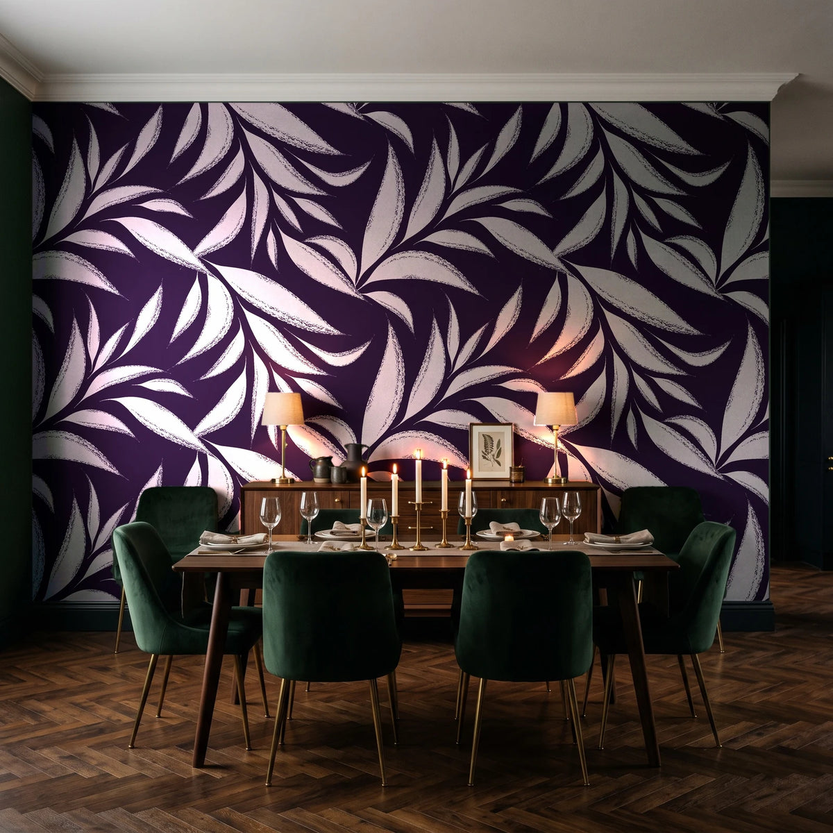 Ink Thicket Aubergine bold leaf wallpaper in a dark moody dining room with a candlelit table