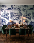 Inked Grove Midnight pastoral toile wallpaper in a dark moody dining room with a candlelit table