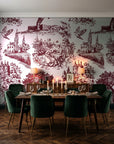 Inked Grove Oxblood pastoral toile wallpaper in a dark moody dining room with a candlelit table