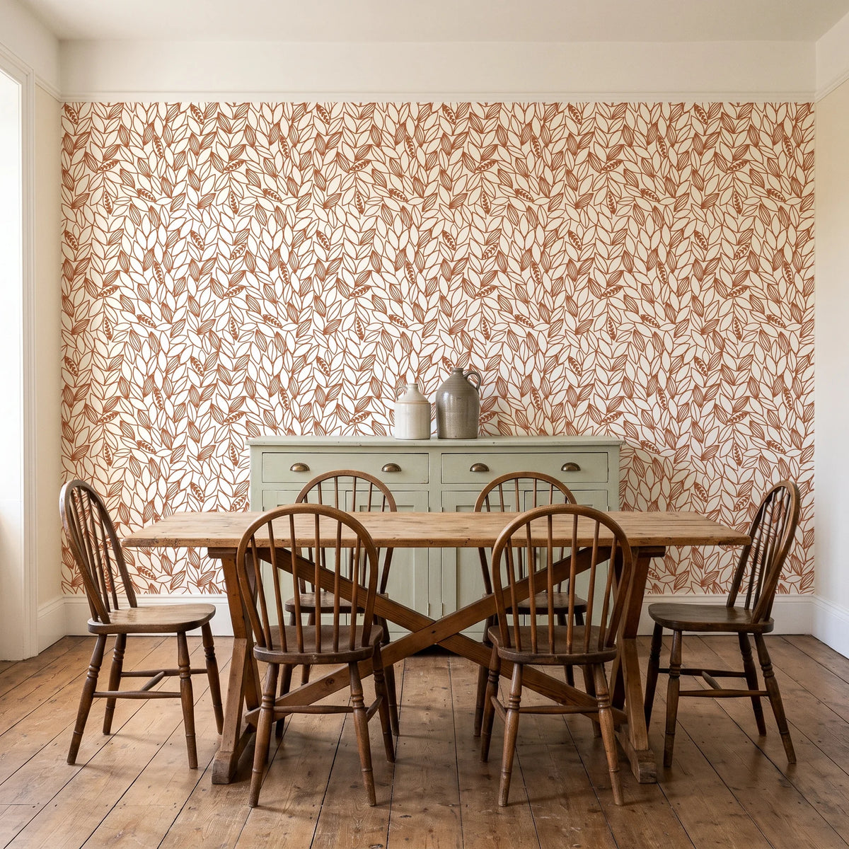Khaki Leaf Clay botanical leaf wallpaper in a farmhouse dining room with a sage sideboard and rustic trestle table