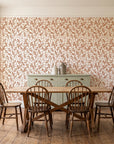 Khaki Leaf Clay botanical leaf wallpaper in a farmhouse dining room with a sage sideboard and rustic trestle table