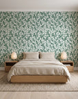Khaki Leaf Evergreen botanical leaf wallpaper behind a low platform bed in a serene Japandi bedroom