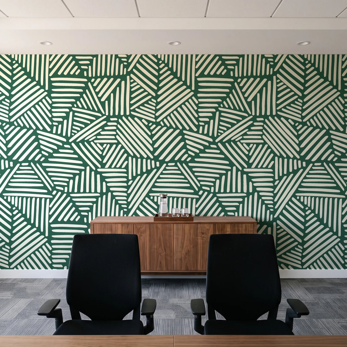Kinetic Etch Emerald hand-drawn lines wallpaper above a walnut credenza in a modern conference room