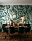 Kinetic Etch Emerald hand-drawn lines wallpaper in a dark moody dining room with a candlelit table