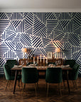 Kinetic Etch Ink hand-drawn lines wallpaper in a dark moody dining room with a candlelit table