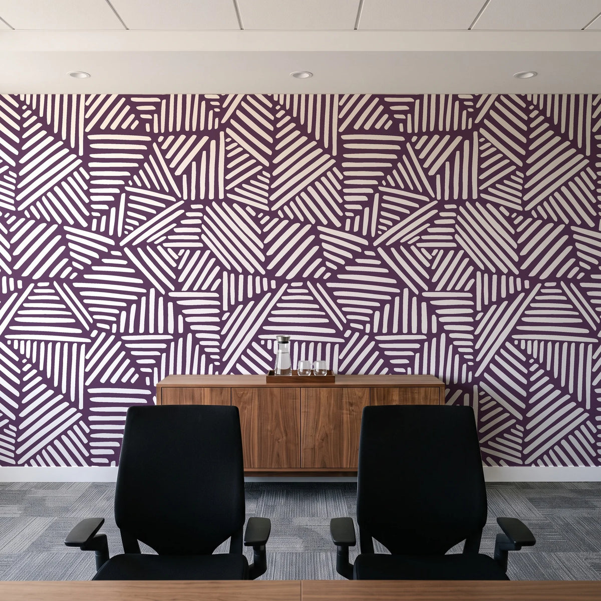 Kinetic Etch Plum hand-drawn lines wallpaper above a walnut credenza in a modern conference room