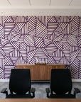 Kinetic Etch Plum hand-drawn lines wallpaper above a walnut credenza in a modern conference room