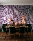 Kinetic Etch Plum hand-drawn lines wallpaper in a dark moody dining room with a candlelit table