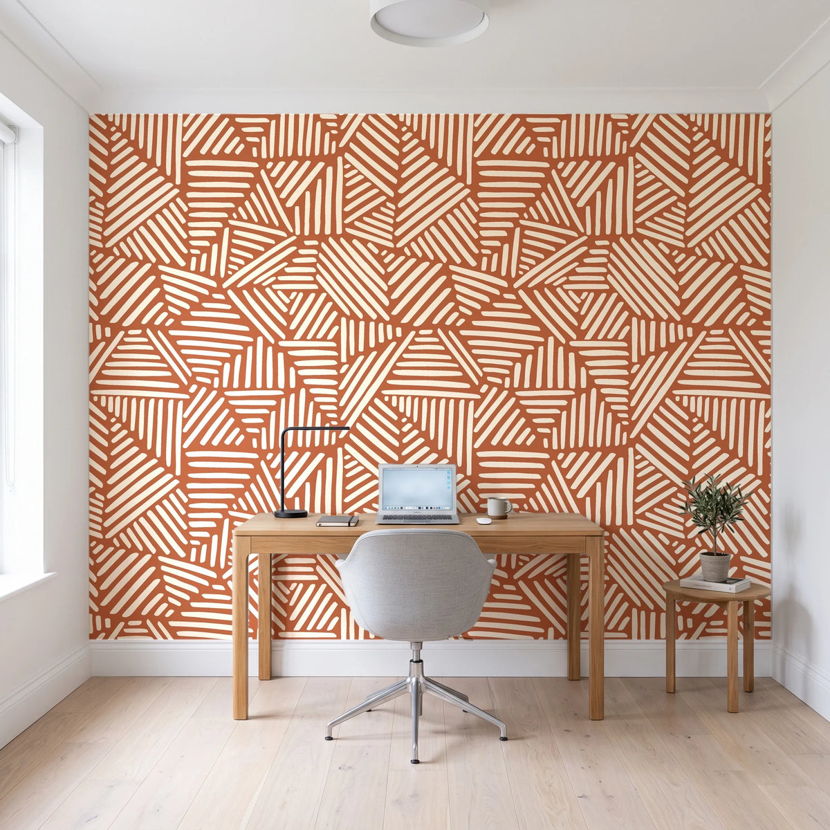 Kinetic Etch Terracotta hand-drawn lines wallpaper behind a modern oak desk in a bright home office