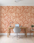 Kinetic Etch Terracotta hand-drawn lines wallpaper behind a modern oak desk in a bright home office