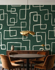 Linear Circuit Emerald minimalist line wallpaper behind a walnut credenza and round table in an elegant dining room