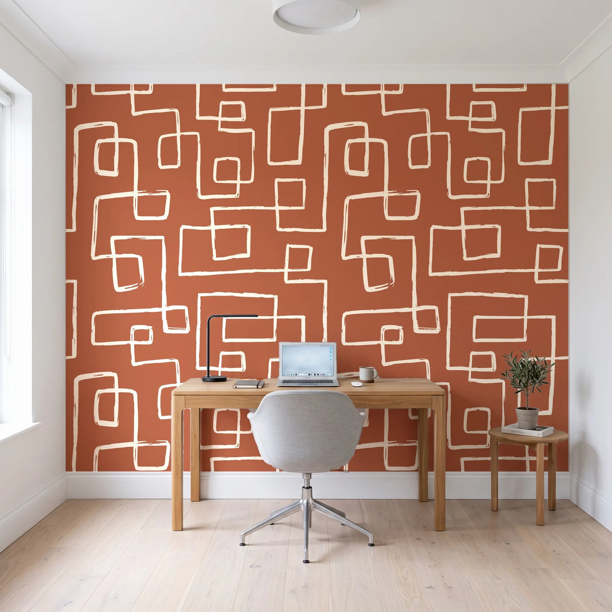 Linear Circuit Terracotta minimalist line wallpaper behind a modern oak desk in a bright home office