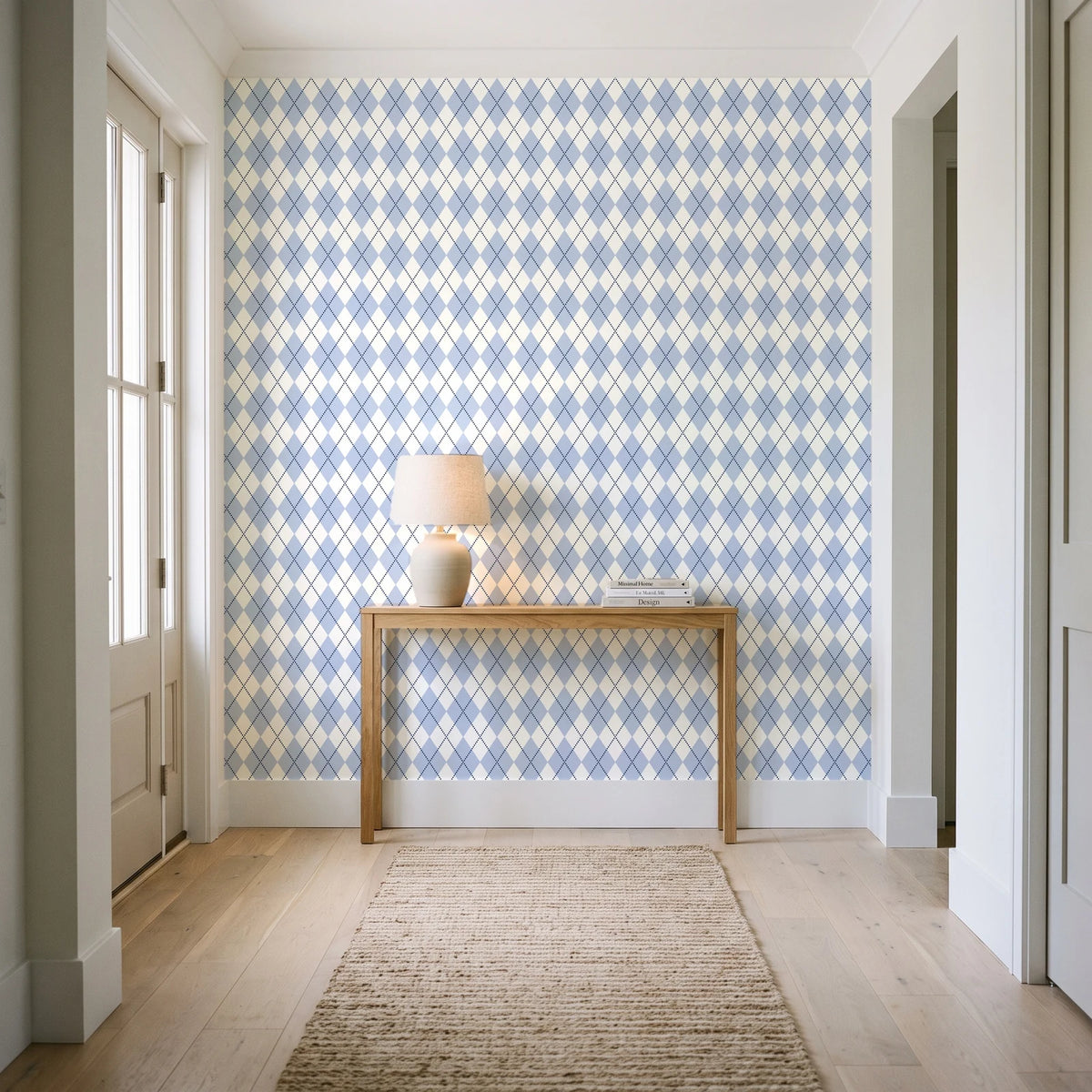 Linen Diamonds Navy argyle wallpaper behind a console table in a light entry hallway